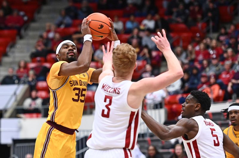 Jan 28, 2023; Pullman, Washington, USA; Arizona State Sun Devils guard Devan Cambridge (35) shoots the ball against Washington State Cougars guard Jabe Mullins (3) in the first half at Friel Court at Beasley Coliseum. Mandatory Credit: James Snook-USA TODAY Sports