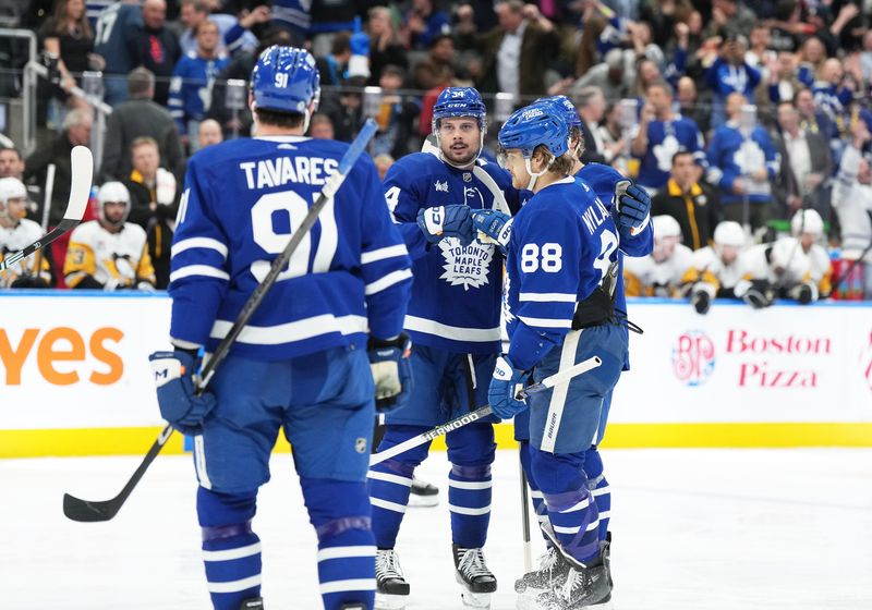 Apr 8, 2024; Toronto, Ontario, CAN; Toronto Maple Leafs center Auston Matthews (34) scores a goal and celebrates with right wing William Nylander (88) against the Pittsburgh Penguins during the third period at Scotiabank Arena. Mandatory Credit: Nick Turchiaro-USA TODAY Sports