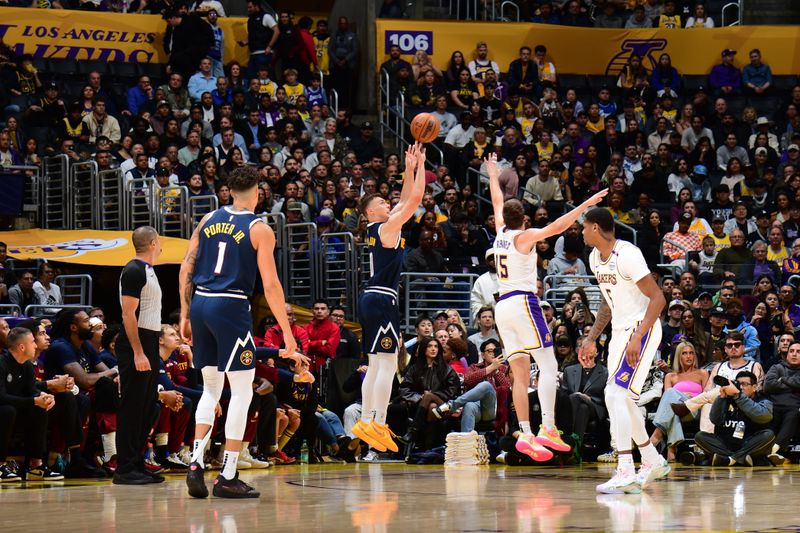 LOS ANGELES, CA - NOVEMBER 23: Christian Braun #0 of the Denver Nuggets shoots the ball during the game against the Los Angeles Lakers on November 23, 2024 at Crypto.Com Arena in Los Angeles, California. NOTE TO USER: User expressly acknowledges and agrees that, by downloading and/or using this Photograph, user is consenting to the terms and conditions of the Getty Images License Agreement. Mandatory Copyright Notice: Copyright 2024 NBAE (Photo by Adam Pantozzi/NBAE via Getty Images)