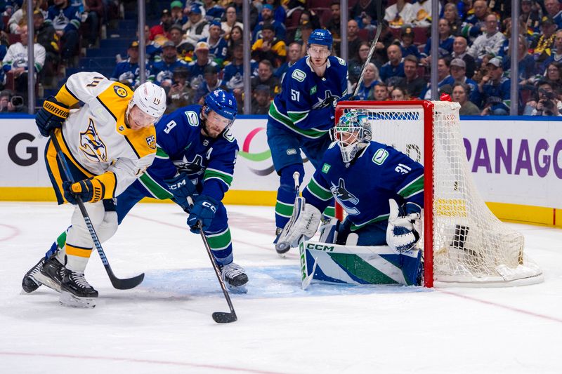 Apr 30, 2024; Vancouver, British Columbia, CAN; Vancouver Canucks goalie Arturs Silvos (31) watches as Nashville Predators forward Gustav Nyquist (14) battles with forward J.T. Miller (9) during the second period in game five of the first round of the 2024 Stanley Cup Playoffs at Rogers Arena. Mandatory Credit: Bob Frid-USA TODAY Sports