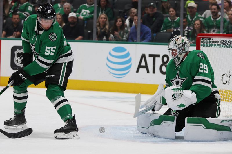 Oct 19, 2024; Dallas, Texas, USA; Dallas Stars goaltender Jake Oettinger (29) makes a save against the Edmonton Oilers as Stars defenseman Thomas Harley (55) looks on in the first period at American Airlines Center. Mandatory Credit: Tim Heitman-Imagn Images