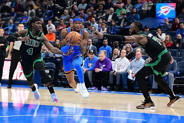 OKLAHOMA CITY, OKLAHOMA - JANUARY 2: Shai Gilgeous-Alexander #2 of the Oklahoma City Thunder drives during the second half against the Boston Celtics at Paycom Center on January 2, 2024 in Oklahoma City, Oklahoma. NOTE TO USER: User expressly acknowledges and agrees that, by downloading and or using this Photograph, user is consenting to the terms and conditions of the Getty Images License Agreement. (Photo by Joshua Gateley/Getty Images)