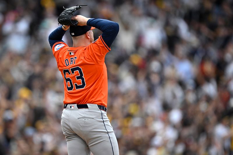 Sep 18, 2024; San Diego, California, USA; Houston Astros relief pitcher Kaleb Ort (63) reacts after a home run by San Diego Padres first baseman Donovan Solano (not pictured) during the eighth inning at Petco Park. Mandatory Credit: Orlando Ramirez-Imagn Images