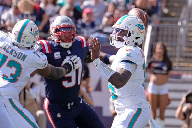 Miami Dolphins quarterback Tyler Huntley (18) throws a pass against the New England Patriots during the first half of an NFL football game, Sunday, Oct. 6, 2024, in Foxborough, Mass. (AP Photo/Michael Dwyer)