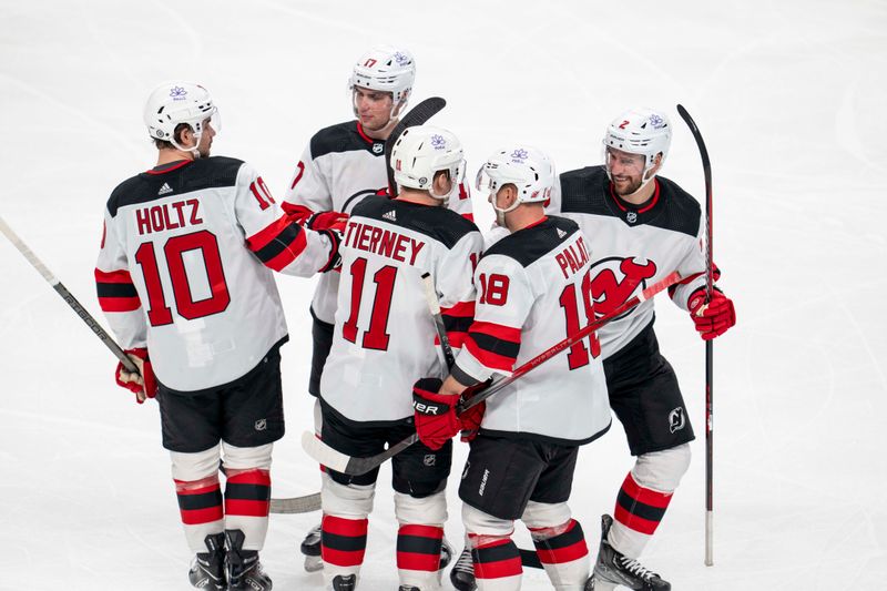 Feb 27, 2024; San Jose, California, USA;  New Jersey Devils right wing Alexander Holtz (10) and center Chris Tierney (11) and left wing Ondrej Palat (18) and defenseman Brendan Smith (2) and defenseman Simon Nemec (17) celebrate after the goal against the San Jose Sharks during the third period at SAP Center at San Jose. Mandatory Credit: Neville E. Guard-USA TODAY Sports