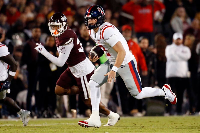 Nov 23, 2023; Starkville, Mississippi, USA; Mississippi Rebels quarterback Jaxson Dart (2) runs the ball during the first half against the Mississippi State Bulldogs at Davis Wade Stadium at Scott Field. Mandatory Credit: Petre Thomas-USA TODAY Sports