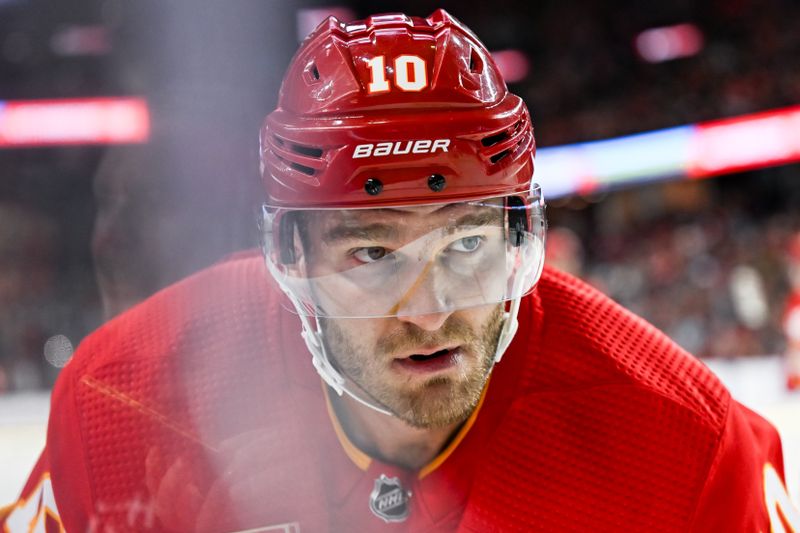 Mar 2, 2024; Calgary, Alberta, CAN; Calgary Flames center Jonathan Huberdeau (10) looks on before a face-off against the Pittsburgh Penguins during the first period at Scotiabank Saddledome. Mandatory Credit: Brett Holmes-USA TODAY Sports