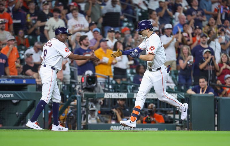 Jul 10, 2024; Houston, Texas, USA; Houston Astros right fielder Joey Loperfido (10) celebrates with third base coach Gary Pettis (8) after hitting a home run during the second inning against the Miami Marlins at Minute Maid Park. Mandatory Credit: Troy Taormina-USA TODAY Sports