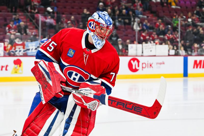 Jan 19, 2025; Montreal, Quebec, CAN; Montreal Canadiens goalie Jakub Dobes (75) looks on during warm-up before the game against the New York Rangers at Bell Centre. Mandatory Credit: David Kirouac-Imagn Images