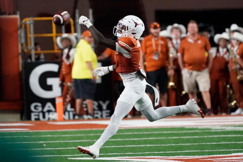 Sep 16, 2023; Austin, Texas, USA; Texas Longhorns wide receiver Xavier Worthy (1) reaches for a pass during the first half against the Wyoming Cowboys at Darrell K Royal-Texas Memorial Stadium. Mandatory Credit: Scott Wachter-USA TODAY Sports