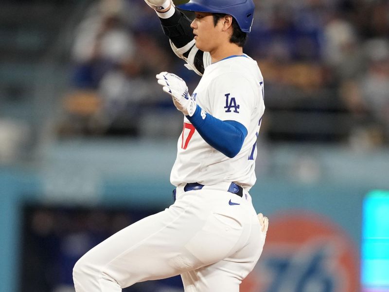 May 21, 2024; Los Angeles, California, USA; Los Angeles Dodgers designated hitter Shohei Ohtani (17) gestures after hitting a double in the fourth inning against the Arizona Diamondbacks at Dodger Stadium. Mandatory Credit: Kirby Lee-USA TODAY Sports