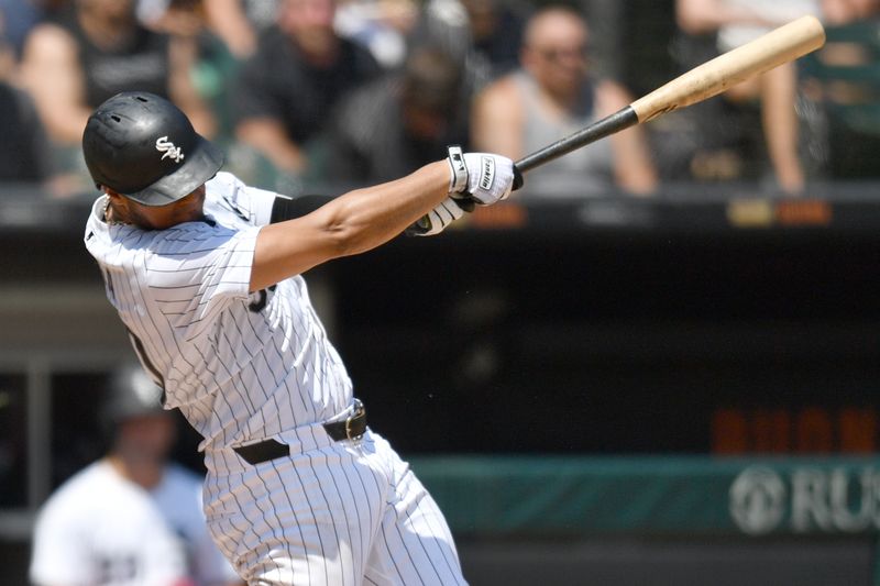 Jun 29, 2024; Chicago, Illinois, USA; Chicago White Sox third base Lenyn Sosa (50) hits a two-run home run during the fifth inning against the Colorado Rockies at Guaranteed Rate Field. Mandatory Credit: Patrick Gorski-USA TODAY Sports