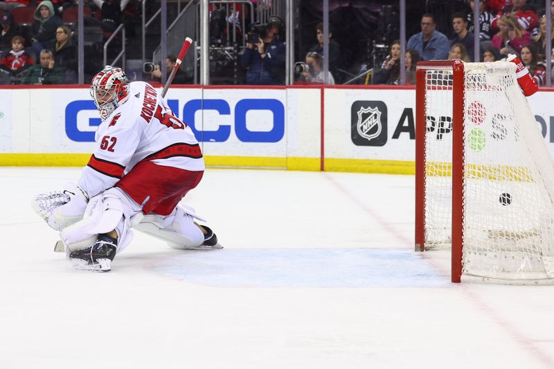 Mar 9, 2024; Newark, New Jersey, USA; New Jersey Devils center Nico Hischier (13) (not shown) scores a goal against the Carolina Hurricanes during the second period at Prudential Center. Mandatory Credit: Ed Mulholland-USA TODAY Sports