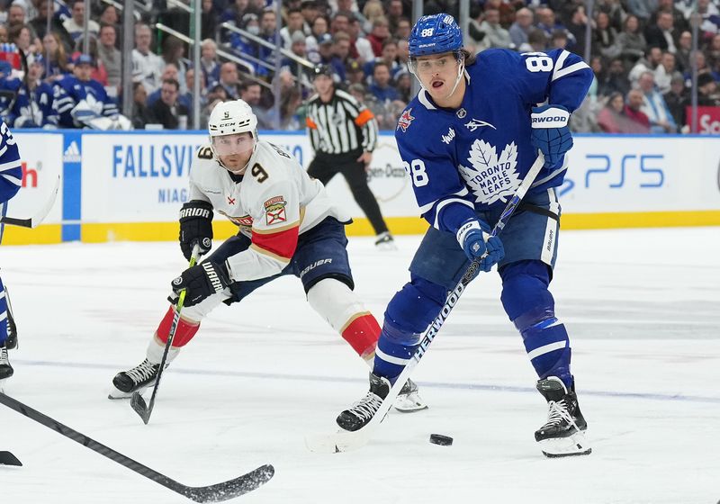 Nov 28, 2023; Toronto, Ontario, CAN; Toronto Maple Leafs right wing William Nylander (88) battles for the puck with Florida Panthers center Sam Bennett (9) during the third period at Scotiabank Arena. Mandatory Credit: Nick Turchiaro-USA TODAY Sports