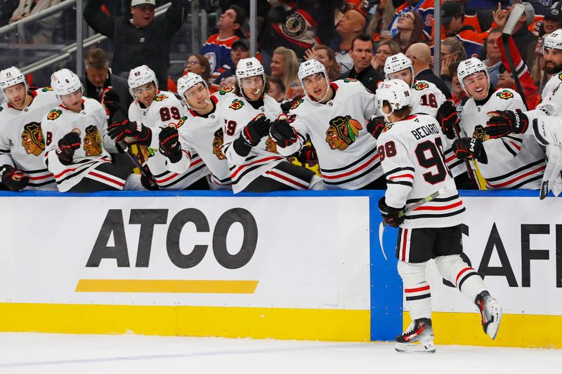 Oct 12, 2024; Edmonton, Alberta, CAN; The Chicago Blackhawks celebrate a goal scored by  forward Connor Bedard (98) during the second period against the Edmonton Oilers at Rogers Place. Mandatory Credit: Perry Nelson-Imagn Images