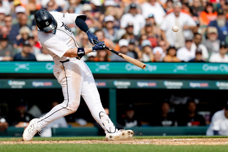 Sep 20, 2025; Detroit, Michigan, USA;  Detroit Tigers first base Spencer Torkelson (20) hits a two run home run in the seventh inning against the Atlanta Braves  in the seventh inning against the Atlanta Braves at Comerica Park. Mandatory Credit: Rick Osentoski-Imagn Images