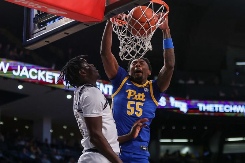 Jan 23, 2024; Atlanta, Georgia, USA; Pittsburgh Panthers forward Zack Austin (55) dunks past Georgia Tech Yellow Jackets forward Baye Ndongo (11) in the first half at McCamish Pavilion. Mandatory Credit: Brett Davis-USA TODAY Sports
