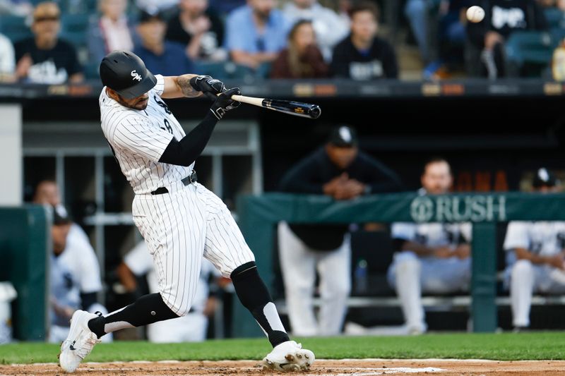 Apr 30, 2024; Chicago, Illinois, USA; Chicago White Sox outfielder Tommy Pham (28) doubles against the Minnesota Twins during the third inning at Guaranteed Rate Field. Mandatory Credit: Kamil Krzaczynski-USA TODAY Sports
