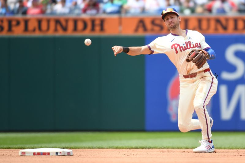 Jun 1, 2025; Philadelphia, Pennsylvania, USA; Philadelphia Phillies shortstop Trea Turner (7) throws to first base during the fourth inning against the Milwaukee Brewers at Citizens Bank Park. Mandatory Credit: Eric Hartline-Imagn Images