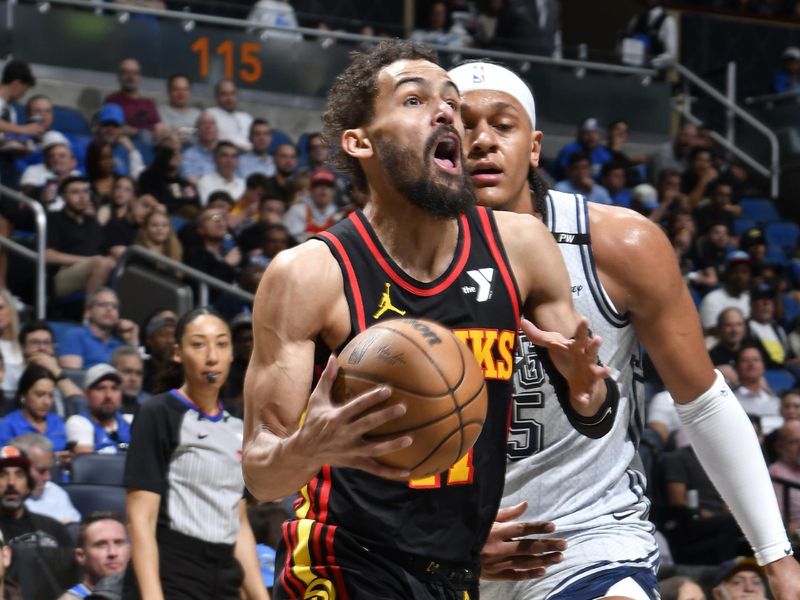 ORLANDO, FL - FEBRUARY 10: Trae Young #11 of the Atlanta Hawks drives to the basket during the game against the Orlando Magic on February 10, 2025 at Kia Center in Orlando, Florida. NOTE TO USER: User expressly acknowledges and agrees that, by downloading and or using this photograph, User is consenting to the terms and conditions of the Getty Images License Agreement. Mandatory Copyright Notice: Copyright 2025 NBAE (Photo by Fernando Medina/NBAE via Getty Images)