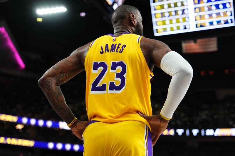 LAS VEGAS, NV - OCTOBER 15: LeBron James #23 of the Los Angeles Lakers looks on during the game against the Golden State Warriors during the 2024 NBA Preseason on October 15, 2024 at T-Mobile Arena in Las Vegas, Nevada. NOTE TO USER: User expressly acknowledges and agrees that, by downloading and or using this photograph, User is consenting to the terms and conditions of the Getty Images License Agreement. Mandatory Copyright Notice: Copyright 2024 NBAE  (Photo by Jeff Bottari/NBAE via Getty Images)