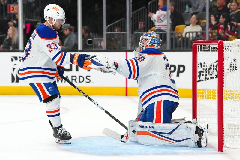 Apr 1, 2025; Las Vegas, Nevada, USA; Edmonton Oilers left wing Viktor Arvidsson (33) celebrates with Edmonton Oilers goaltender Calvin Pickard (30) after scoring a goal against the Vegas Golden Knights during the second period at T-Mobile Arena. Mandatory Credit: Stephen R. Sylvanie-Imagn Images