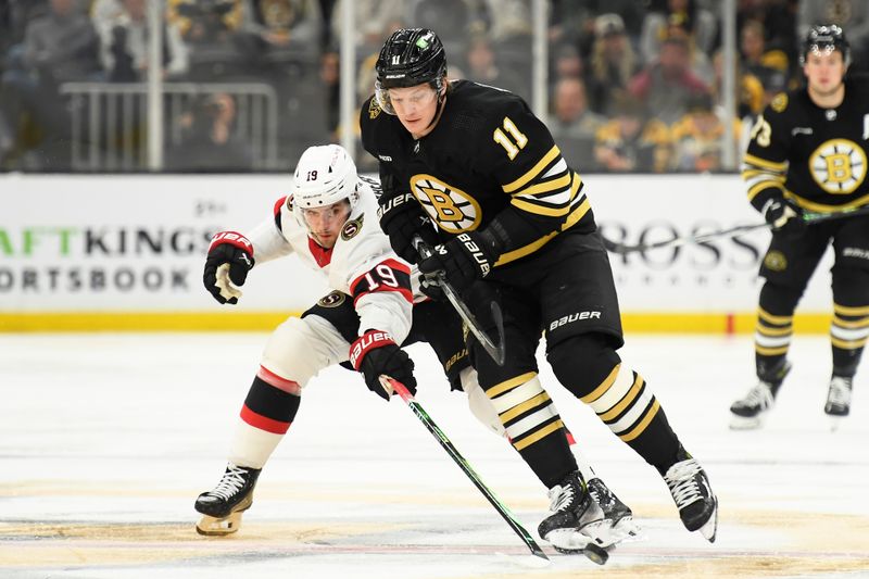 Apr 16, 2024; Boston, Massachusetts, USA;  Ottawa Senators right wing Drake Batherson (19) and Boston Bruins center Trent Frederic (11) battle for the puck during the third period at TD Garden. Mandatory Credit: Bob DeChiara-USA TODAY Sports