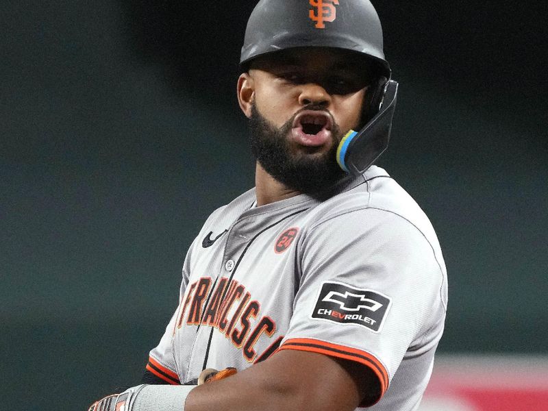 Sep 24, 2024; Phoenix, Arizona, USA; San Francisco Giants outfielder Heliot Ramos (17) reacts after hitting a single against the Arizona Diamondbacks in the eighth inning at Chase Field. Mandatory Credit: Rick Scuteri-Imagn Images