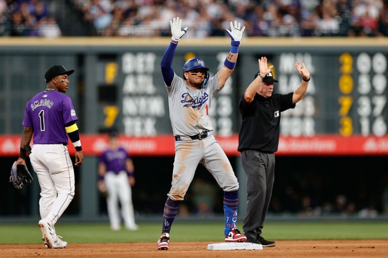 Jun 17, 2024; Denver, Colorado, USA; Los Angeles Dodgers shortstop Miguel Rojas (11) reacts from second on an RBI double in the seventh inning against the Colorado Rockies at Coors Field. Mandatory Credit: Isaiah J. Downing-USA TODAY Sports