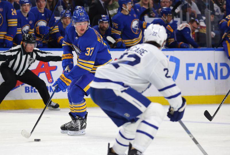 Dec 21, 2023; Buffalo, New York, USA;  Buffalo Sabres center Casey Mittelstadt (37) skates with the puck and looks to make.a pass during the second period against the Toronto Maple Leafs at KeyBank Center. Mandatory Credit: Timothy T. Ludwig-USA TODAY Sports