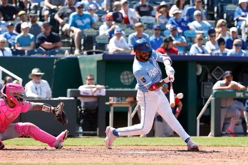 May 11, 2025; Kansas City, Missouri, USA; Kansas City Royals third base Maikel Garcia (11) hits the ball at Kauffman Stadium. Mandatory Credit: Gary Rohman-Imagn Images