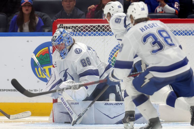 Dec 2, 2025; Elmont, New York, USA; Tampa Bay Lightning goaltender Andrei Vasilevskiy (88) makes a save against the New York Islanders during the third period at UBS Arena. Mandatory Credit: Brad Penner-Imagn Images