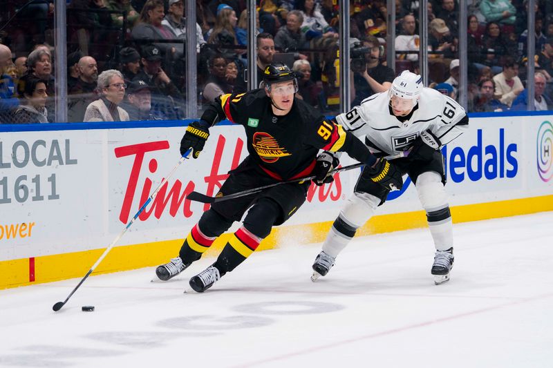 Feb 29, 2024; Vancouver, British Columbia, CAN; Los Angeles Kings forward Trevor Lewis (61) stick checks Vancouver Canucks defenseman Nikita Zadorov (91) in the third period at Rogers Arena. Kings won 5-1. Mandatory Credit: Bob Frid-USA TODAY Sports