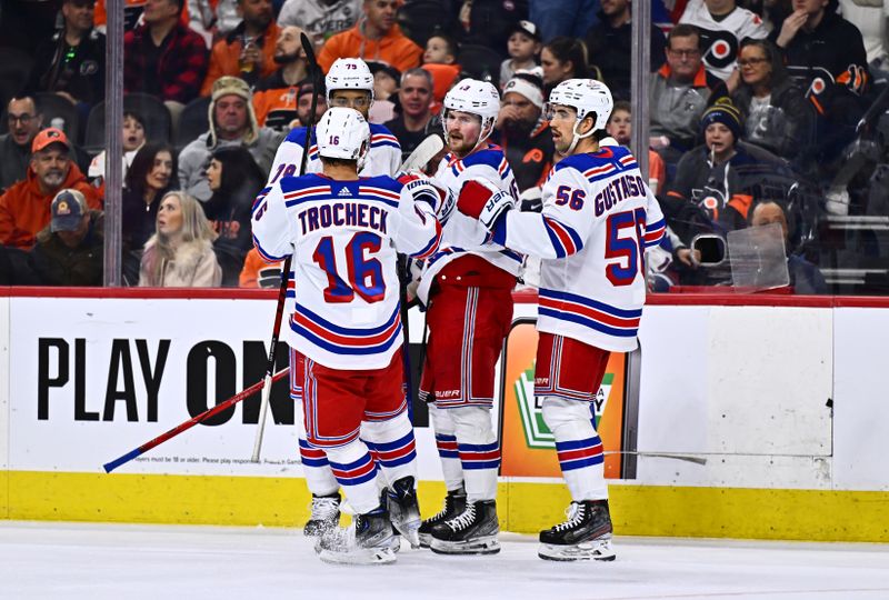 Feb 24, 2024; Philadelphia, Pennsylvania, USA; New York Rangers left wing Alexis Lafreniere (13) celebrates with teammates after scoring a goal against the Philadelphia Flyers in the second period at Wells Fargo Center. Mandatory Credit: Kyle Ross-USA TODAY Sports