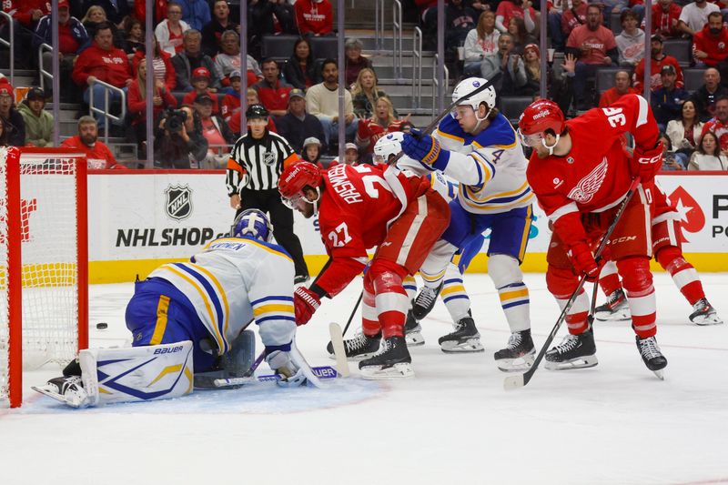 Nov 2, 2024; Detroit, Michigan, USA; Detroit Red Wings center Michael Rasmussen (27) takes a shot on goal in the second period of the game against the Buffalo Sabres at Little Caesars Arena. Mandatory Credit: Brian Bradshaw Sevald-Imagn Images