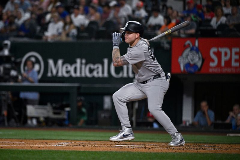 Sep 2, 2024; Arlington, Texas, USA; New York Yankees left fielder Alex Verdugo (24) hits a single against the Texas Rangers during the third inning at Globe Life Field. Mandatory Credit: Jerome Miron-USA TODAY Sports