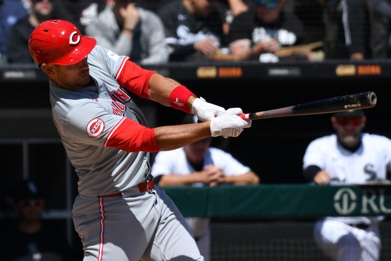 Apr 13, 2024; Chicago, Illinois, USA; Cincinnati Reds catcher Luke Maile (22) hits a two-run single during the second inning against the Chicago White Sox at Guaranteed Rate Field. Mandatory Credit: Patrick Gorski-USA TODAY Sports