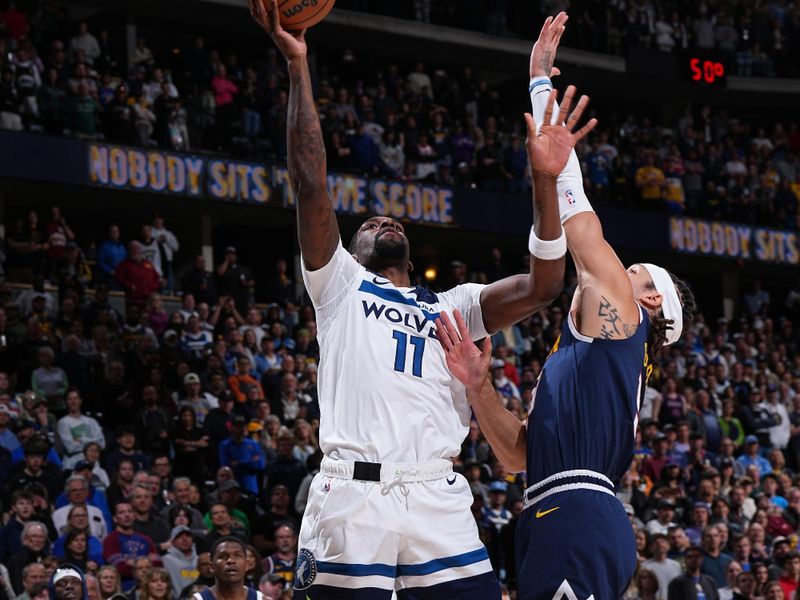 DENVER, CO - APRIL 10: Naz Reid #11 of the Minnesota Timberwolves drives to the basket during the game against the Denver Nuggets on April 10, 2024 at the Ball Arena in Denver, Colorado. NOTE TO USER: User expressly acknowledges and agrees that, by downloading and/or using this Photograph, user is consenting to the terms and conditions of the Getty Images License Agreement. Mandatory Copyright Notice: Copyright 2024 NBAE (Photo by Garrett Ellwood/NBAE via Getty Images)