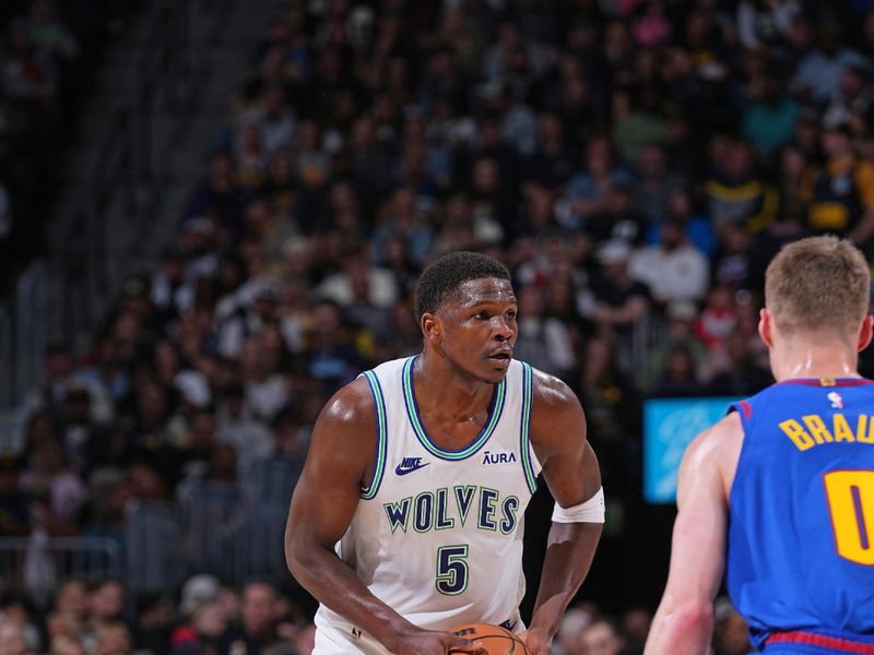 DENVER, CO - MARCH 29: Anthony Edwards #5 of the Minnesota Timberwolves handles the ball during the game against the Denver Nuggets on March 29, 2024 at the Ball Arena in Denver, Colorado. NOTE TO USER: User expressly acknowledges and agrees that, by downloading and/or using this Photograph, user is consenting to the terms and conditions of the Getty Images License Agreement. Mandatory Copyright Notice: Copyright 2024 NBAE (Photo by Bart Young/NBAE via Getty Images)