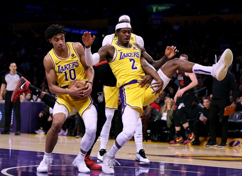 LOS ANGELES, CALIFORNIA - JANUARY 03: Max Christie #10 and Jarred Vanderbilt #2 of the Los Angeles Lakers defend a rebound during a 110-96 Miami Heat win at Crypto.com Arena on January 03, 2024 in Los Angeles, California. (Photo by Harry How/Getty Images)