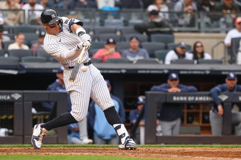 May 4, 2025; Bronx, New York, USA; New York Yankees right fielder Aaron Judge (99) doubles during the eighth inning against the Tampa Bay Rays at Yankee Stadium. Mandatory Credit: Vincent Carchietta-Imagn Images