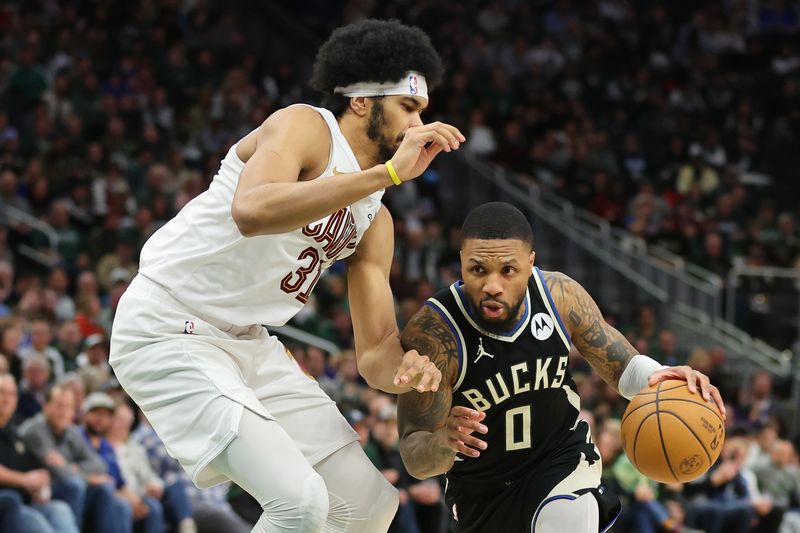 MILWAUKEE, WISCONSIN - JANUARY 26: Damian Lillard #0 of the Milwaukee Bucks is defended by Jarrett Allen #31 of the Cleveland Cavaliers during a game at Fiserv Forum on January 26, 2024 in Milwaukee, Wisconsin. NOTE TO USER: User expressly acknowledges and agrees that, by downloading and or using this photograph, User is consenting to the terms and conditions of the Getty Images License Agreement. (Photo by Stacy Revere/Getty Images)