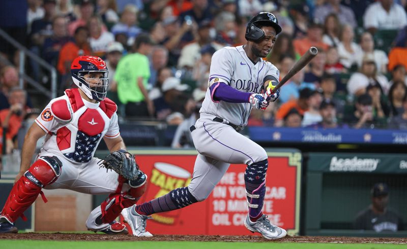 Jul 4, 2023; Houston, Texas, USA; The helmet of Colorado Rockies left fielder Jurickson Profar (29) slips off during a play during the third inning against the Houston Astros at Minute Maid Park. Mandatory Credit: Troy Taormina-USA TODAY Sports