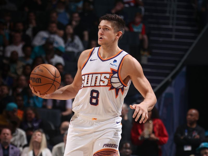 CHARLOTTE, NC - MARCH 15:  Grayson Allen #8 of the Phoenix Suns handles the ball during the game  on March 15, 2024 at Spectrum Center in Charlotte, North Carolina. NOTE TO USER: User expressly acknowledges and agrees that, by downloading and or using this photograph, User is consenting to the terms and conditions of the Getty Images License Agreement.  Mandatory Copyright Notice:  Copyright 2024 NBAE (Photo by Kent Smith/NBAE via Getty Images)