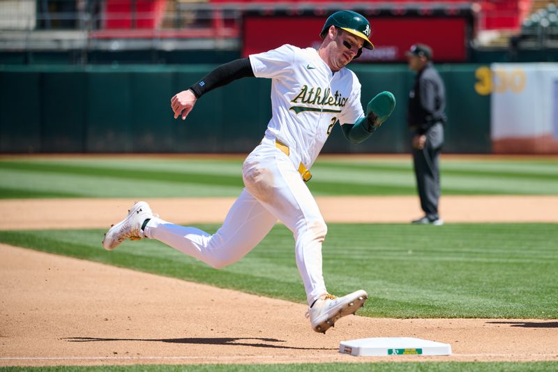 May 5, 2024; Oakland, California, USA; Oakland Athletics designated hitter Brent Rooker (25) rounds third base to score a run against the Miami Marlins during the fourth inning at Oakland-Alameda County Coliseum. Mandatory Credit: Robert Edwards-USA TODAY Sports