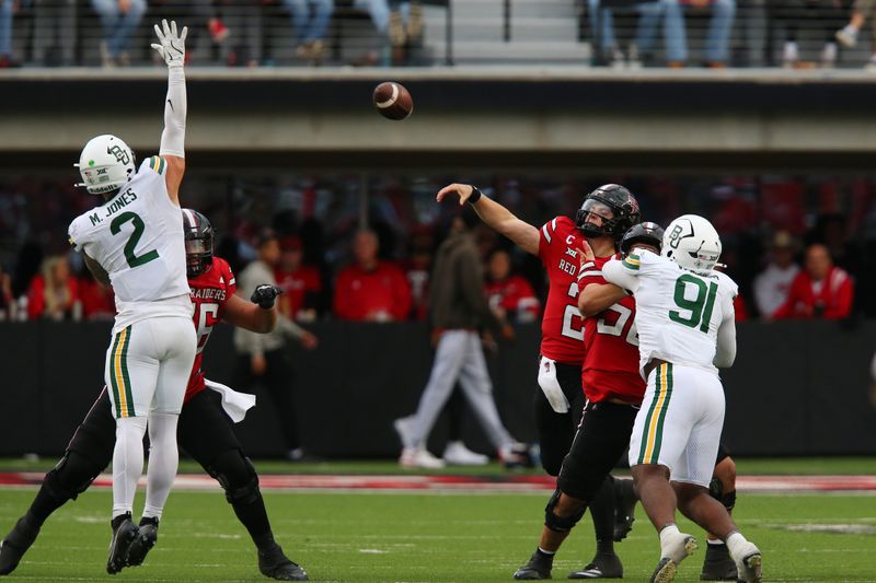 Oct 19, 2024; Lubbock, Texas, USA;  Texas Tech Red Raiders quarterback Behren Morton (2) throws over Baylor Bears defensive back Matt Jones (2) in the second half at Jones AT&T Stadium and Cody Campbell Field. Mandatory Credit: Michael C. Johnson-Imagn Images