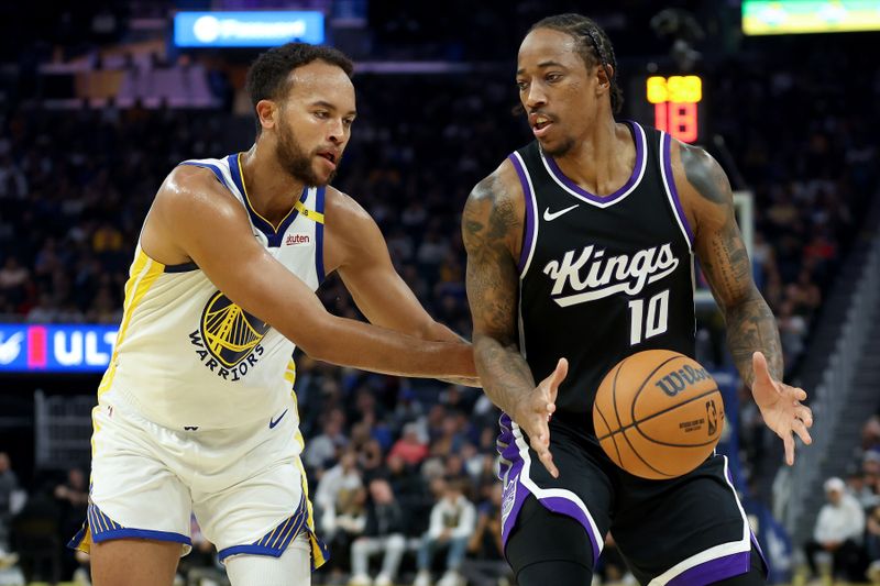 SAN FRANCISCO, CALIFORNIA - OCTOBER 11: DeMar DeRozan #10 of the Sacramento Kings is guarded by Kyle Anderson #1 of the Golden State Warriors during the first quarter of their preseason game at Chase Center on October 11, 2024 in San Francisco, California.  NOTE TO USER: User expressly acknowledges and agrees that, by downloading and/or using this photograph, user is consenting to the terms and conditions of the Getty Images License Agreement.  (Photo by Ezra Shaw/Getty Images)