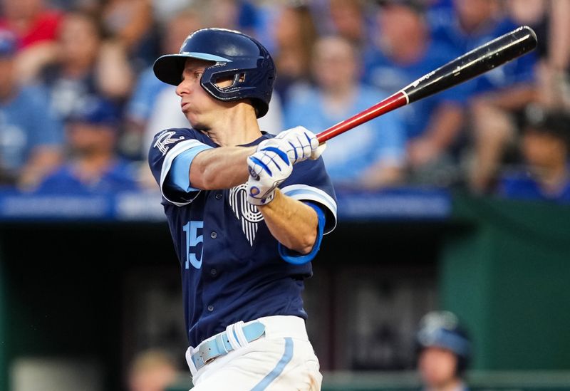 May 26, 2023; Kansas City, Missouri, USA; Kansas City Royals second baseman Matt Duffy (15) hits a single during the fifth inning against the Washington Nationals at Kauffman Stadium. Mandatory Credit: Jay Biggerstaff-USA TODAY Sports