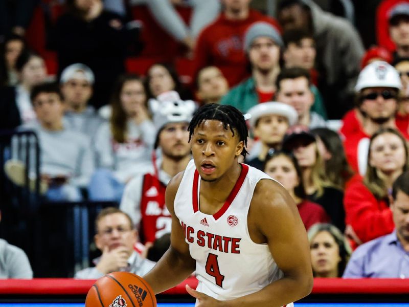 Feb 1, 2023; Raleigh, North Carolina, USA;  North Carolina State Wolfpack guard LJ Thomas (4) dribbles down the court during the second half against Florida State Seminoles at PNC Arena.  Mandatory Credit: Jaylynn Nash-USA TODAY Sports