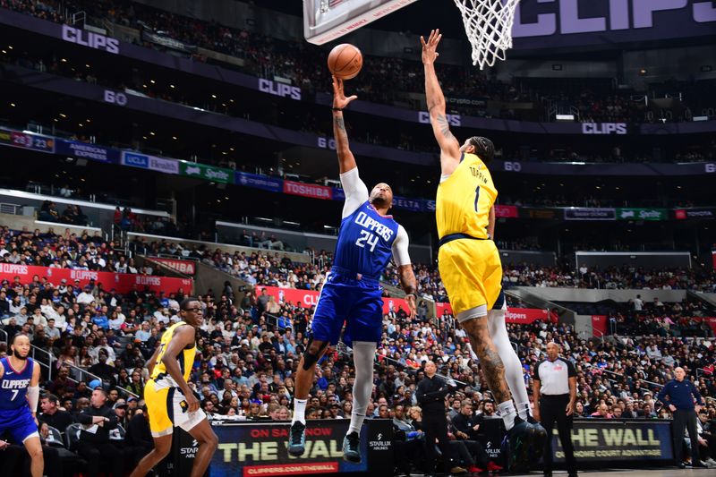 LOS ANGELES, CA - MARCH 25: Norman Powell #24 of the LA Clippers drives to the basket during the game against the Indiana Pacers on March 25, 2024 at Crypto.Com Arena in Los Angeles, California. NOTE TO USER: User expressly acknowledges and agrees that, by downloading and/or using this Photograph, user is consenting to the terms and conditions of the Getty Images License Agreement. Mandatory Copyright Notice: Copyright 2024 NBAE (Photo by Adam Pantozzi/NBAE via Getty Images)